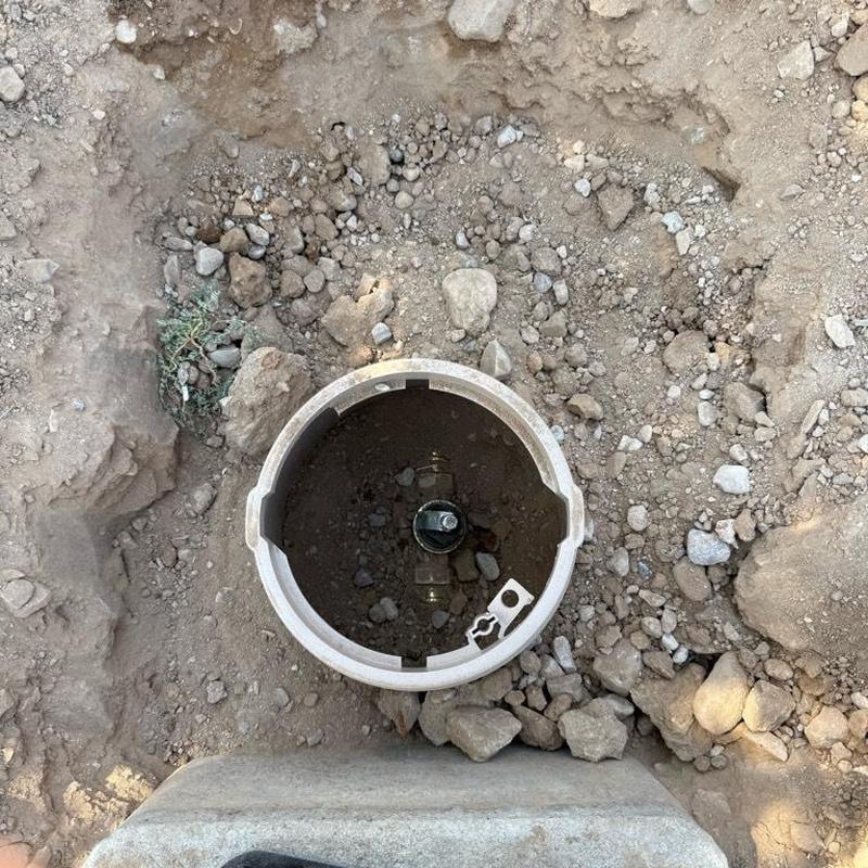 Pressure reducing valve access box installation in soil
