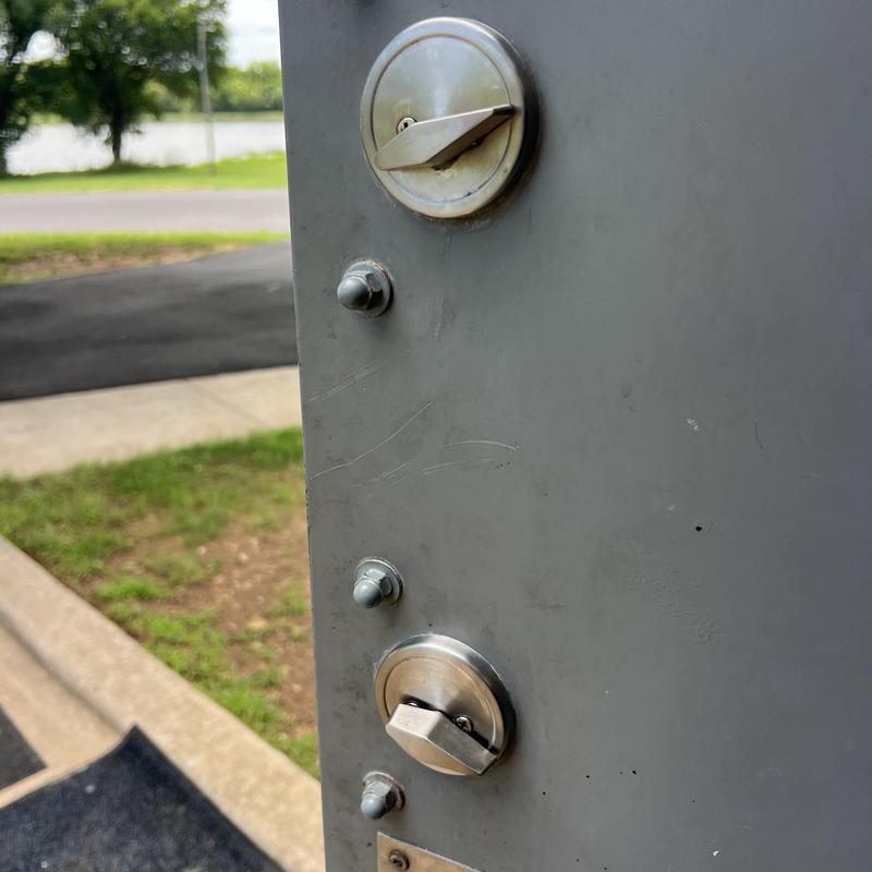 Deadbolt locks on commercial metal door