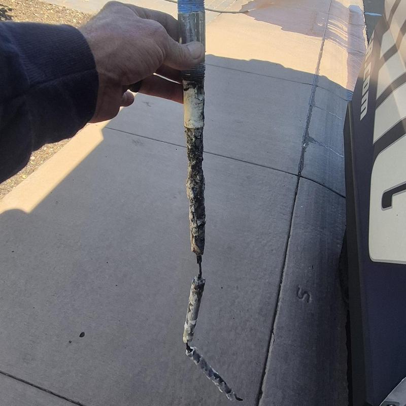 Anode rod removed showing corrosion buildup