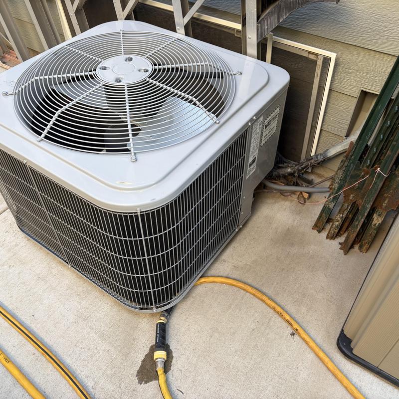 Carrier 3-ton air conditioner unit on concrete pad