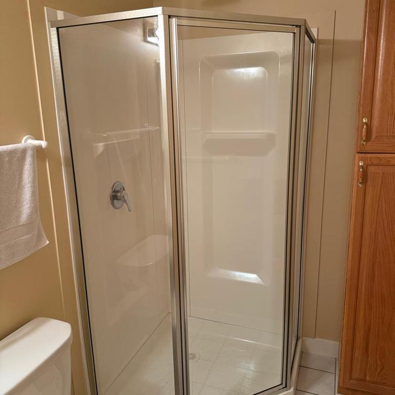 Corner shower glass door installation in bathroom