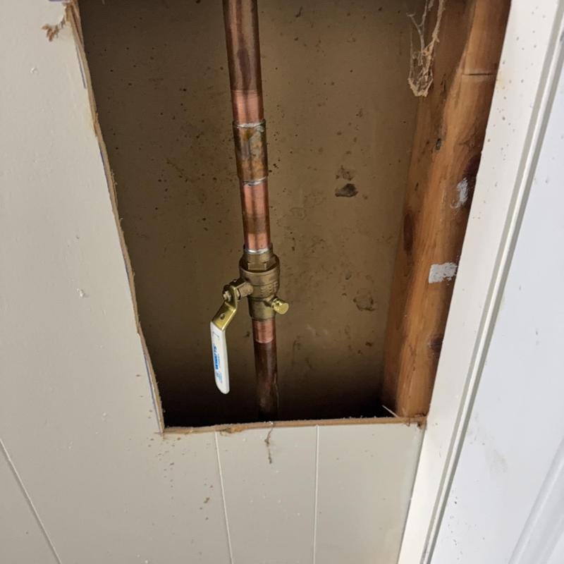 Copper water shut-off valve in wall cavity