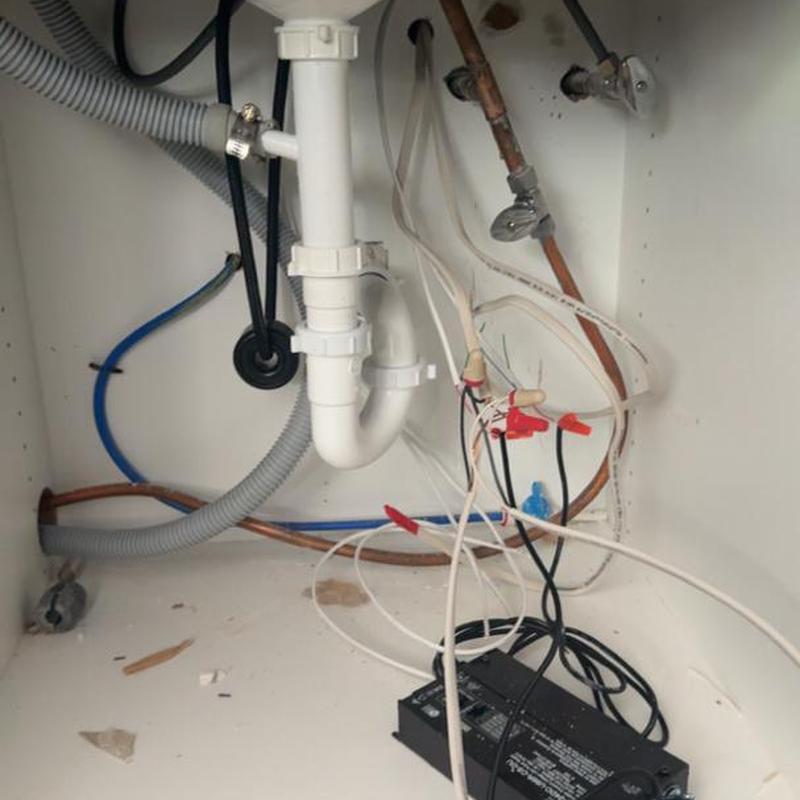Under-sink plumbing and wiring with black power unit