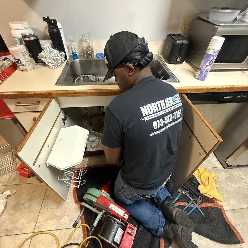 Kitchen sink drain line cleaning with plumber tools Kitchen sink drain line cleaning with plumber tools