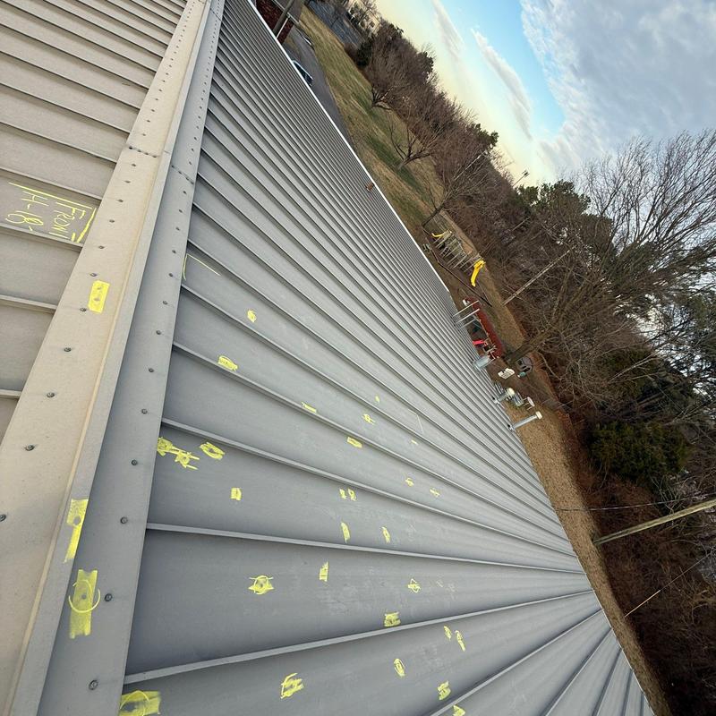 Metal roof panels with hail damage markings