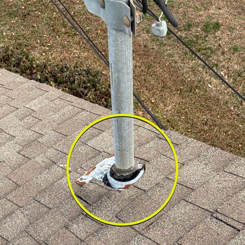 Roof flashing around metal pipe on shingle roof