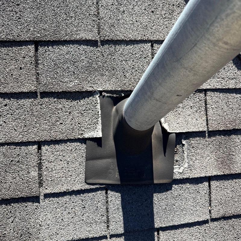 Roof vent pipe flashing damage on asphalt shingles