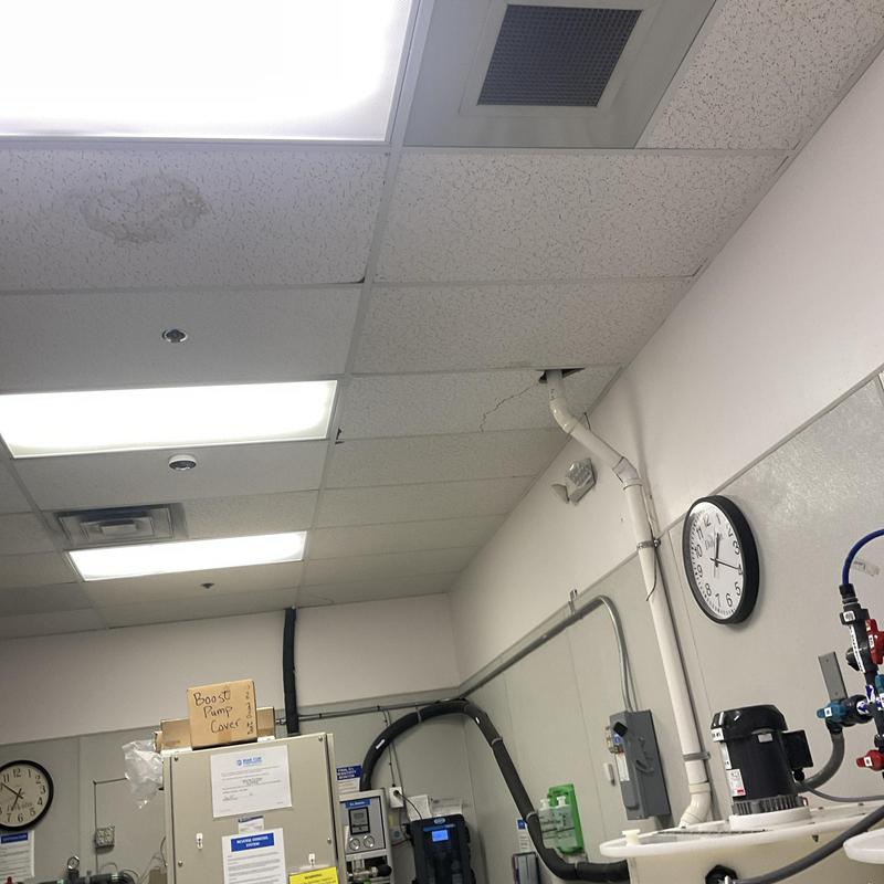 Ceiling air vent and HVAC duct in office room