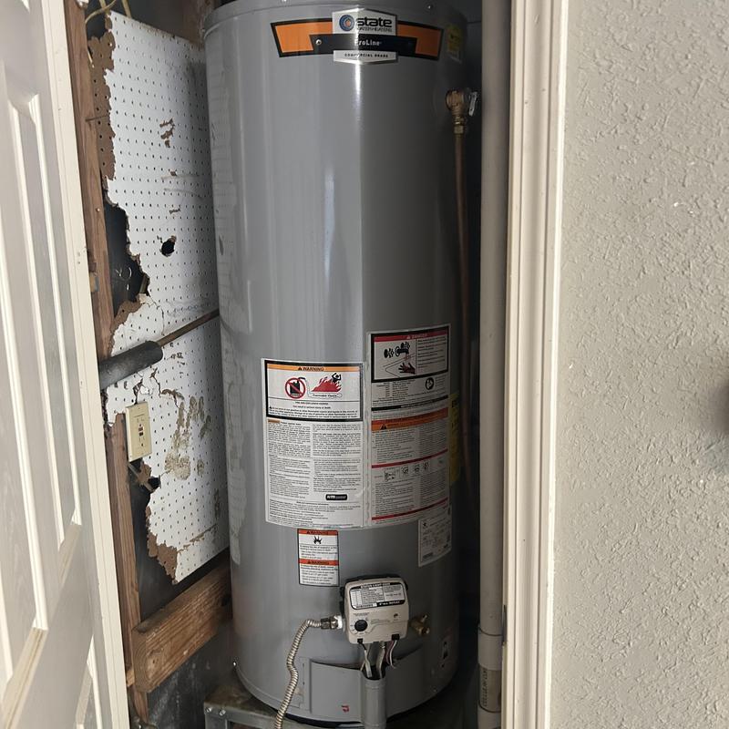 50 gallon gas water heater installed in utility closet