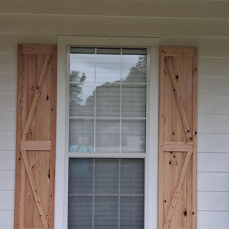 Custom wooden porch window shutters installation Custom wooden porch window shutters installation
