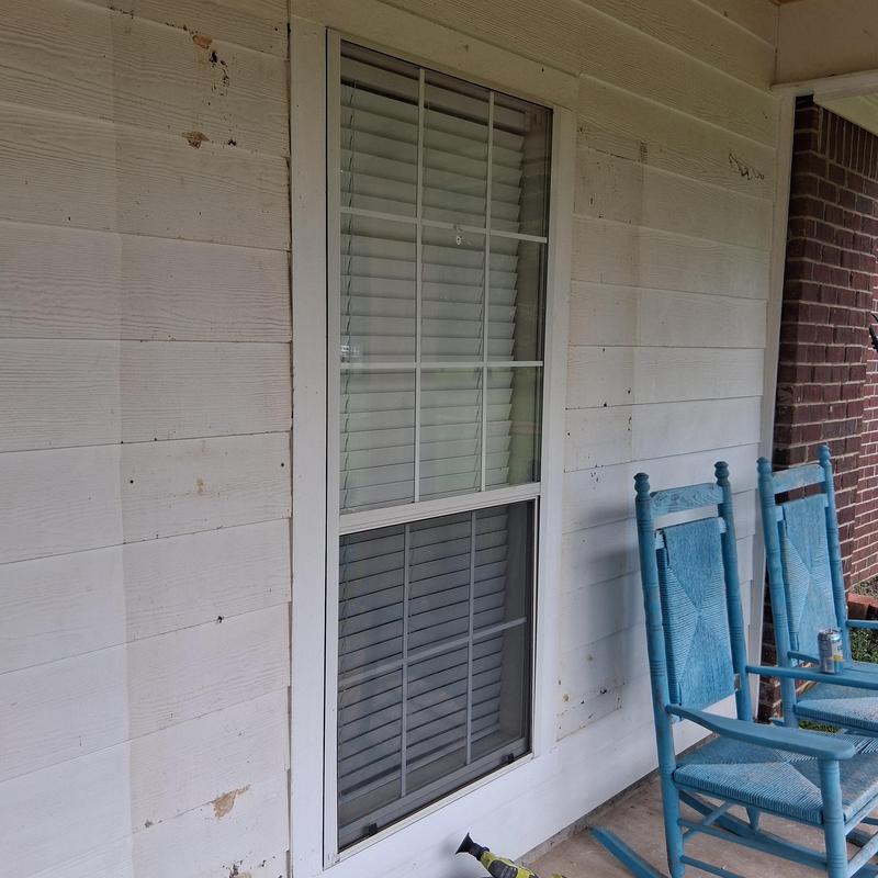 Custom exterior shutters on porch window Custom exterior shutters on porch window