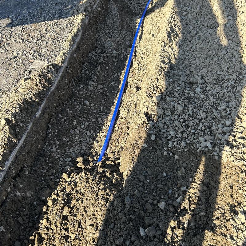 Water service pipe in trench before burial