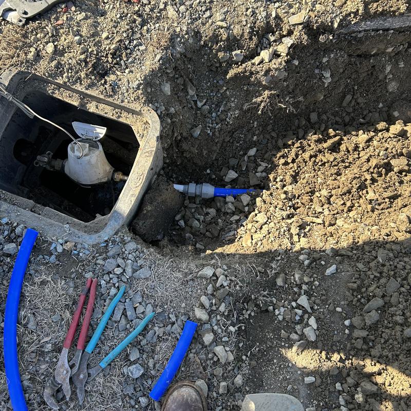 Water meter connection and new underground pipe installation