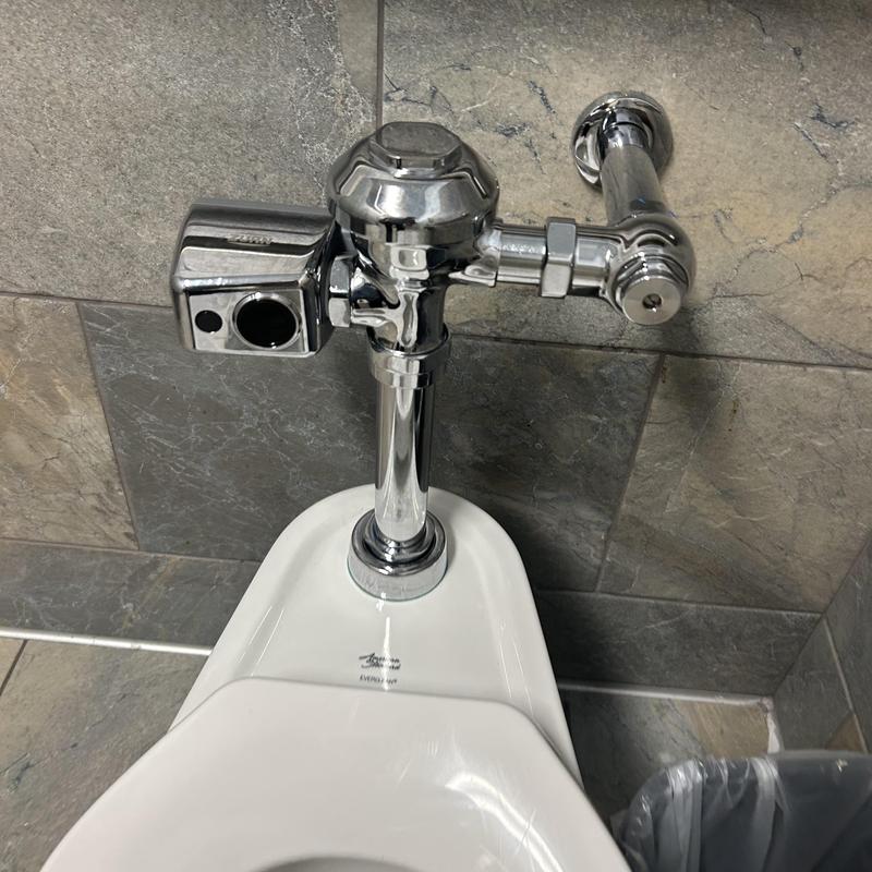Fluorometer flush valve on wall-hung toilet installation