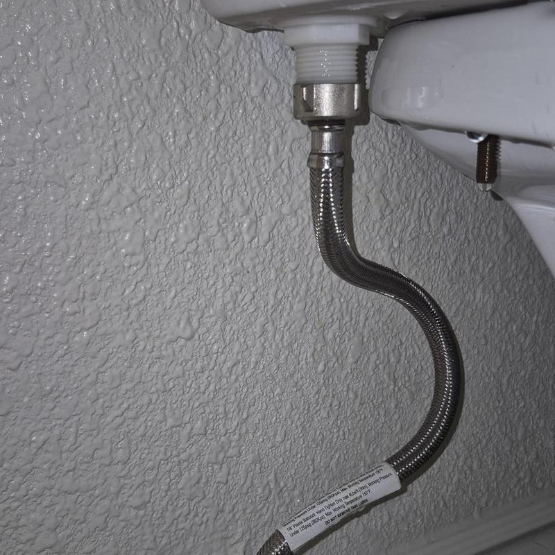 Toilet fill valve supply line with leak drop