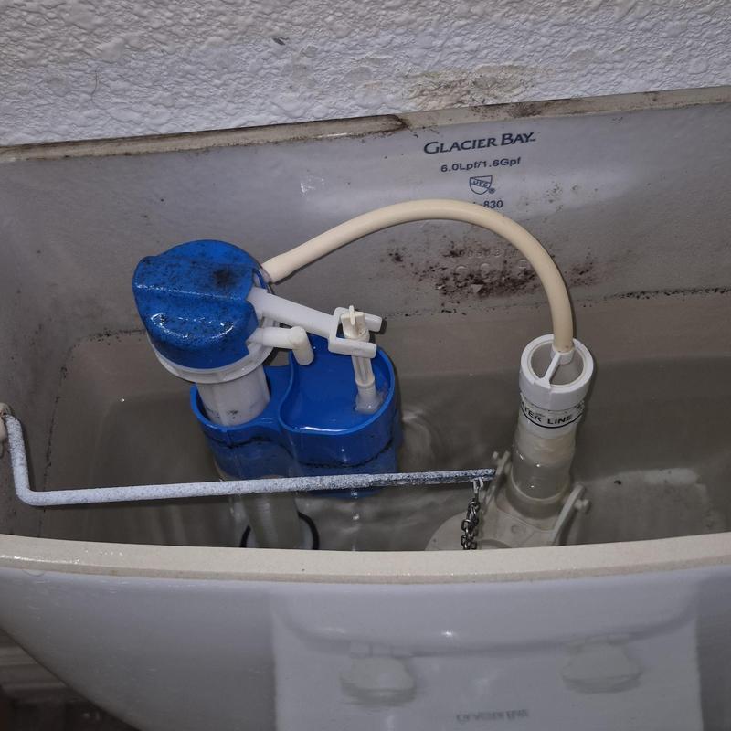 Toilet fill valve assembly inside tank