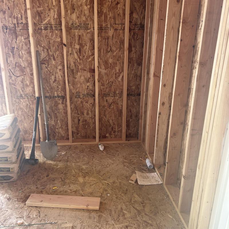 Wood framing and subflooring in garage construction site Wood framing and subflooring in garage construction site