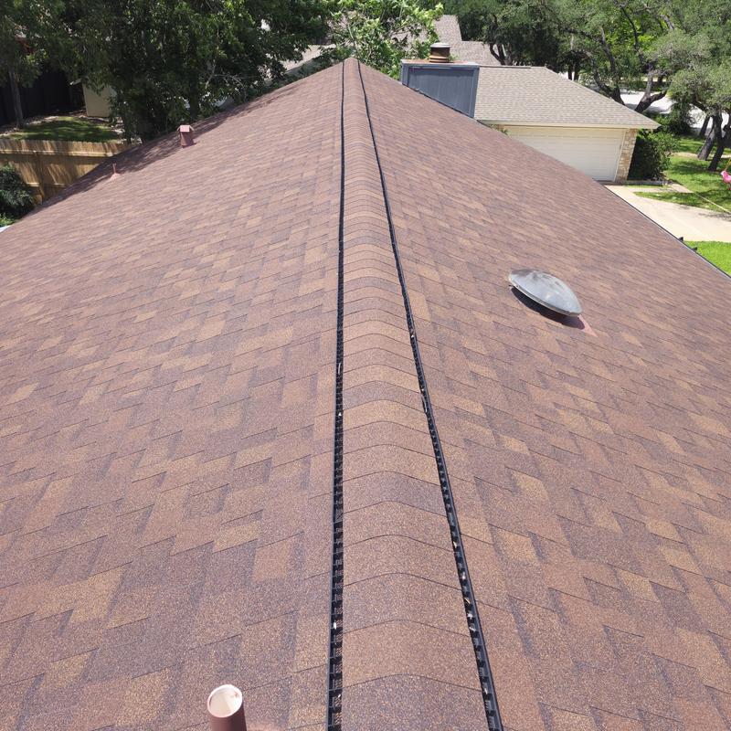 GAF Hickory shingle roof with Cobra III ridge vent installed GAF Hickory shingle roof with Cobra III ridge vent installed