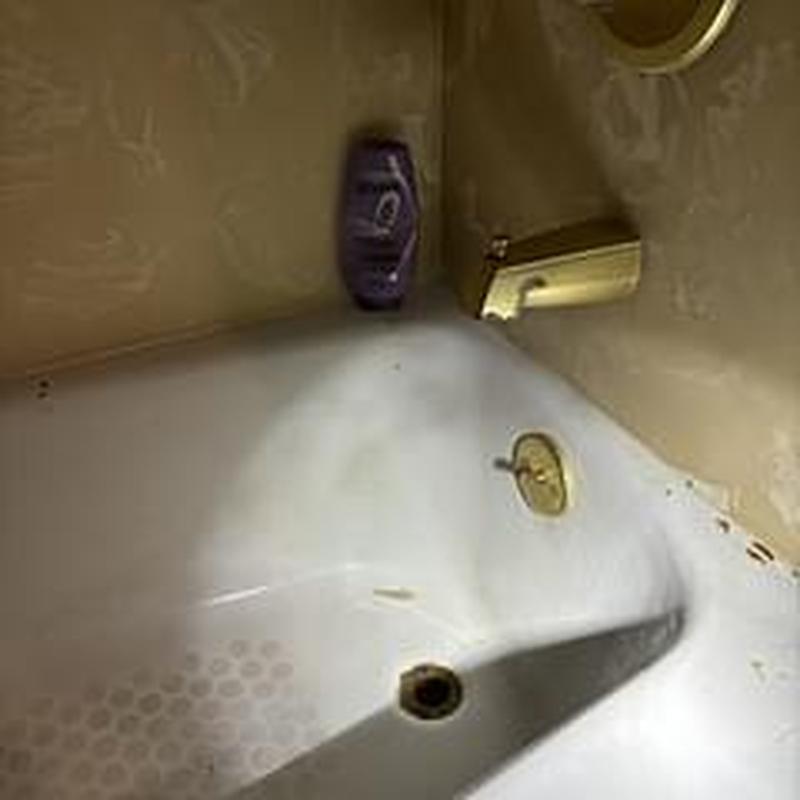Bathtub drain with faucet and soap bottle