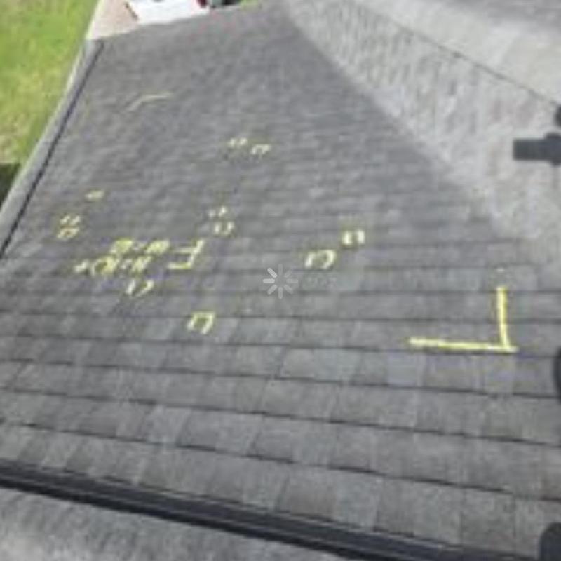 Roof shingles with marked hail damage spots