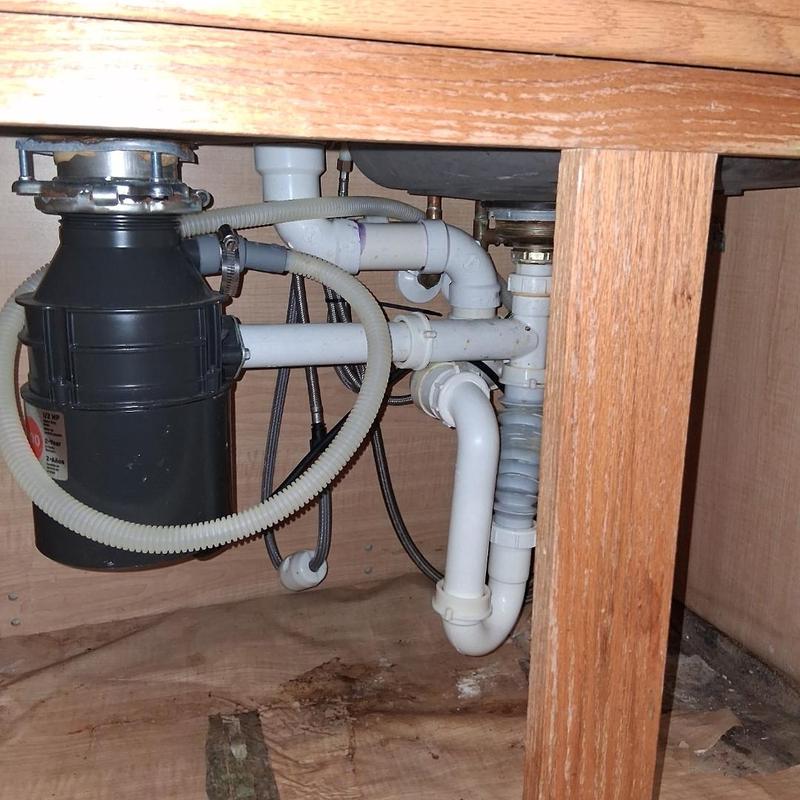 Kitchen sink disposal and drain plumbing installation