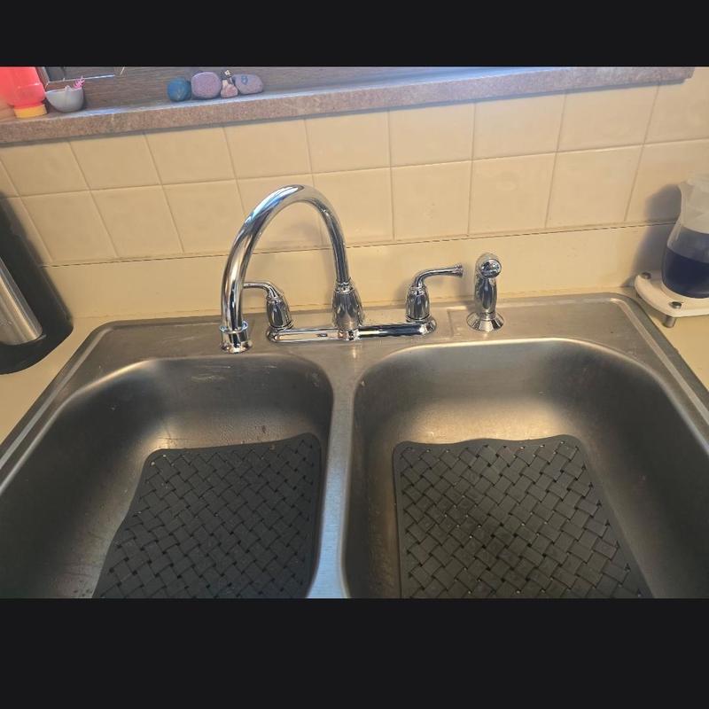 Kitchen faucet installed on double basin sink