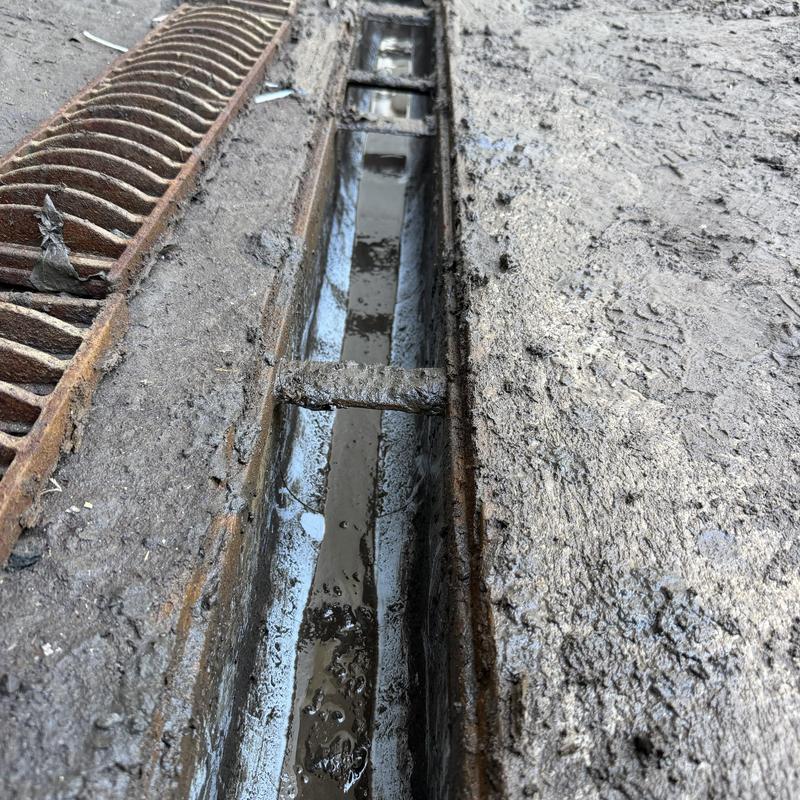 Loading dock drain channel with metal grate removed Loading dock drain channel with metal grate removed
