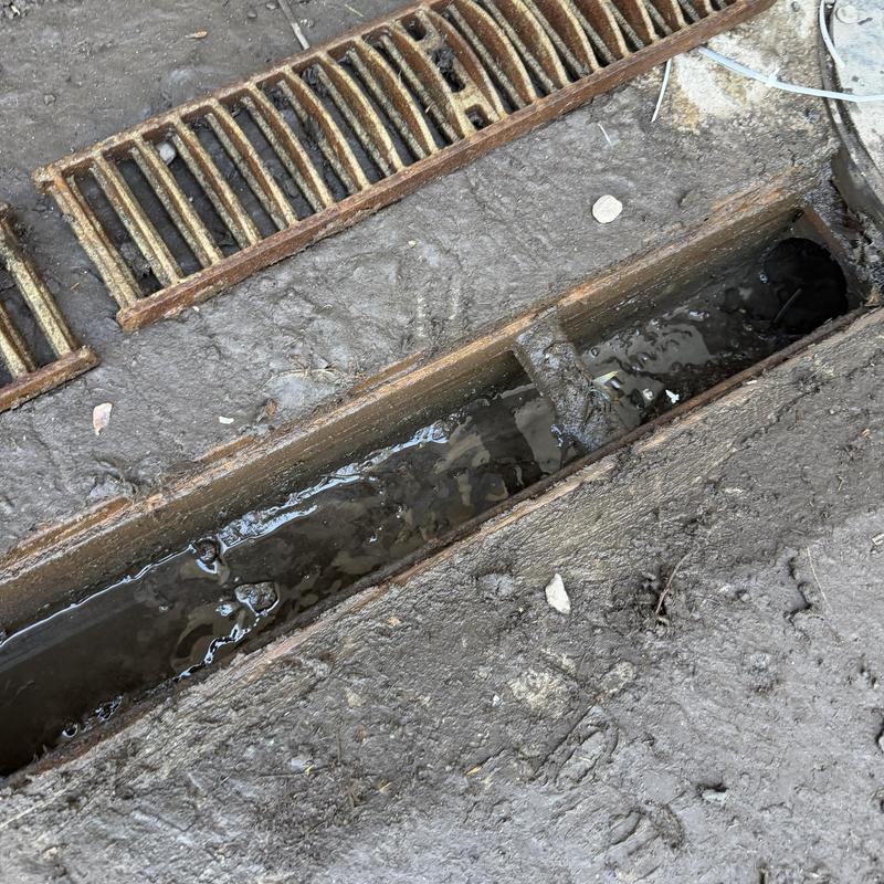 Loading dock drain with removed rusted grate Loading dock drain with removed rusted grate