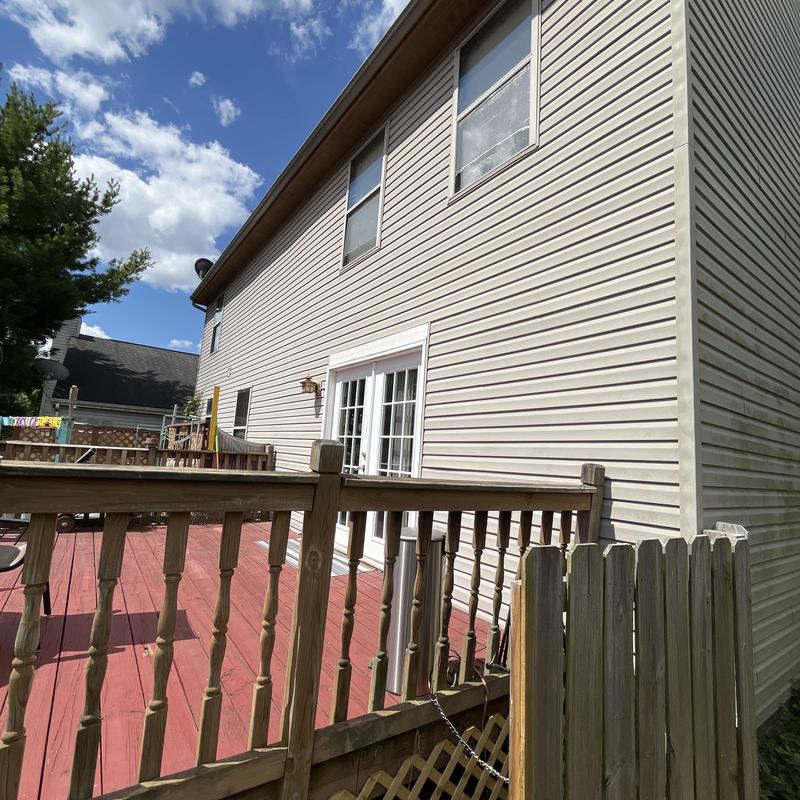 Vinyl siding and deck railing on residential house