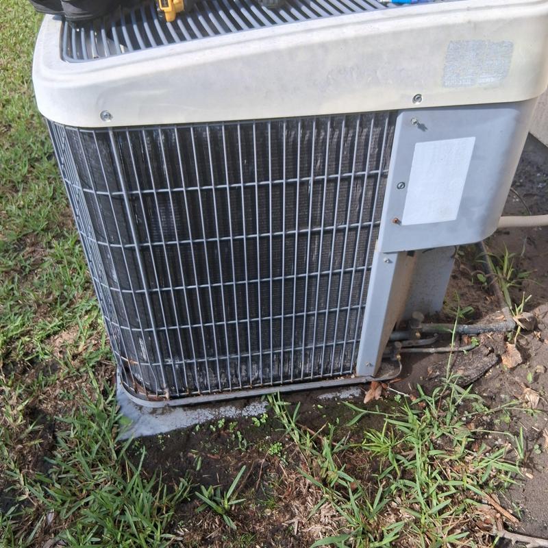 5-ton HVAC condenser unit outdoor installation in grass