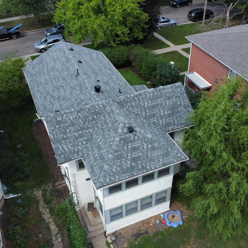 Asphalt shingle roof on residential house, aerial view