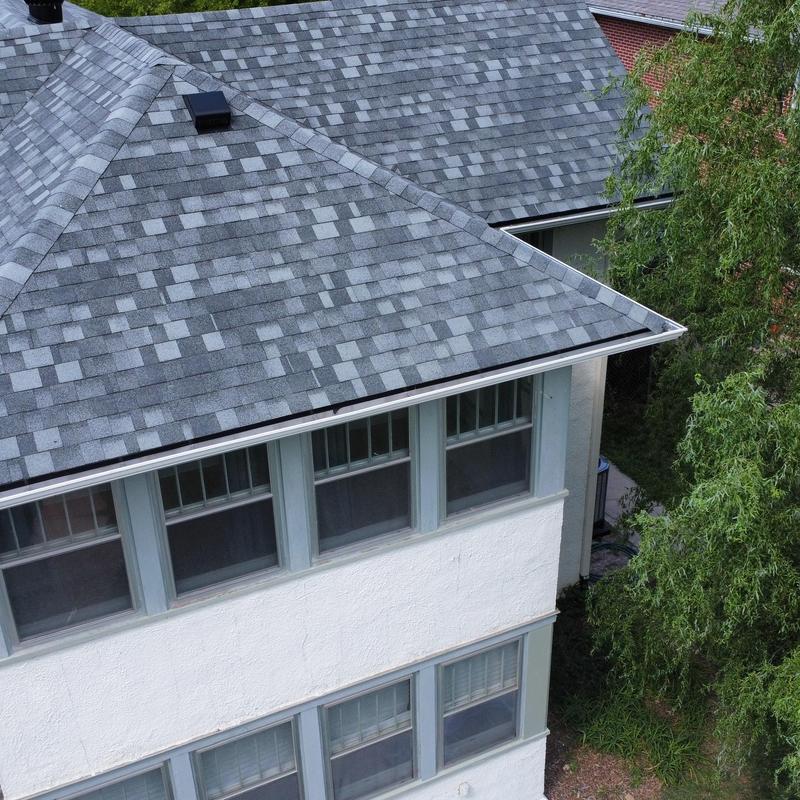 Aluminum seamless gutters on gray shingle roof