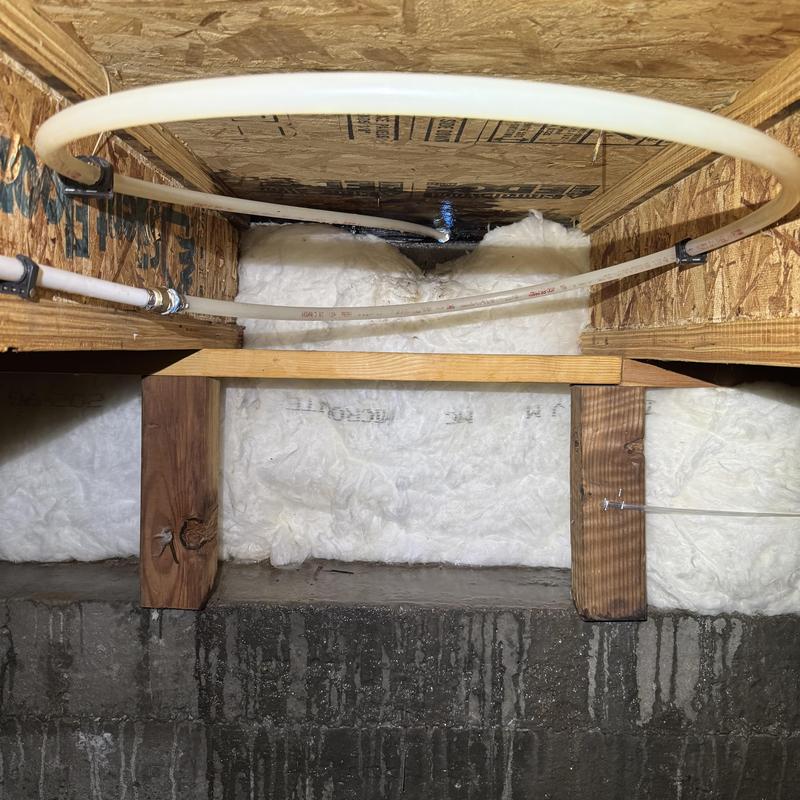 PEX water supply line with insulation in crawl space PEX water supply line with insulation in crawl space