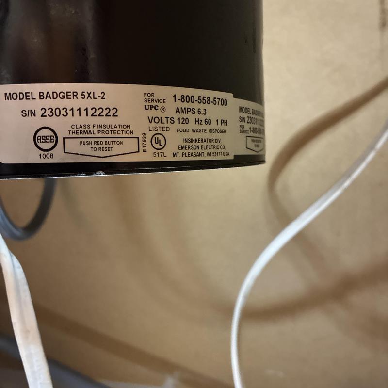 Garbage disposal label and wiring close-up
