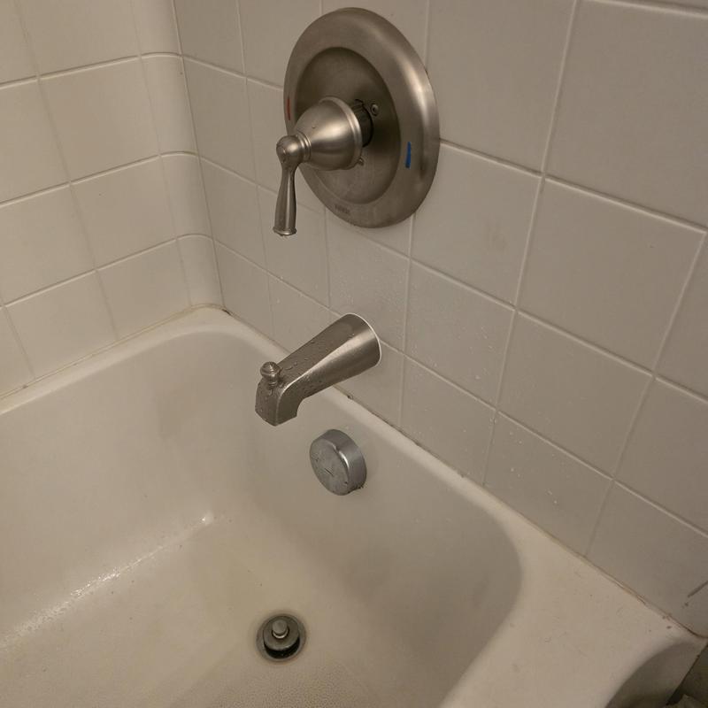 Tub spout and faucet handle installation in bathtub Tub spout and faucet handle installation in bathtub
