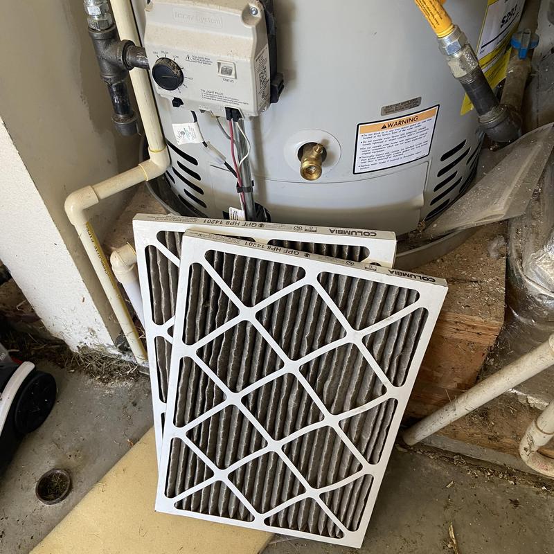 HVAC air filters removed near water heater system