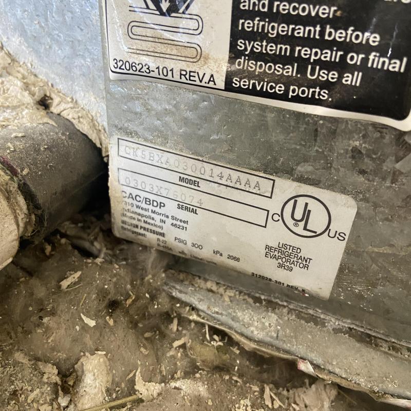 HVAC evaporator unit label with dirt and debris