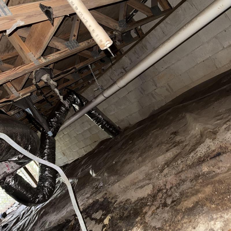 Ductwork and drain lines under house crawl space Ductwork and drain lines under house crawl space
