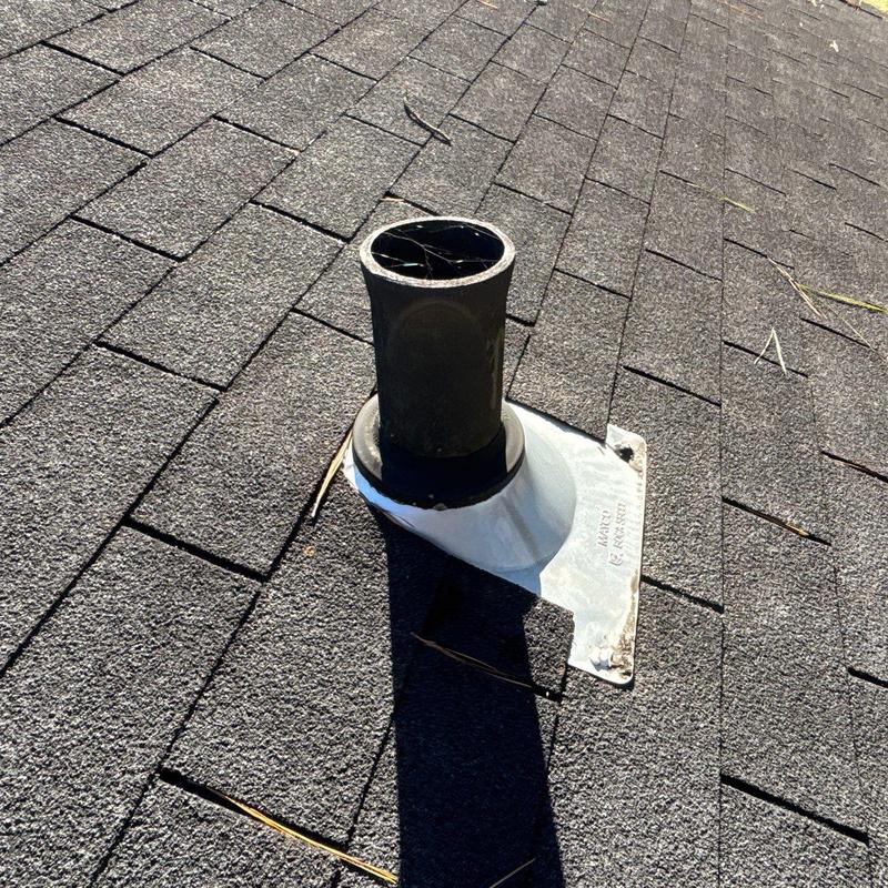 Plumbing vent pipe flashing on asphalt shingle roof