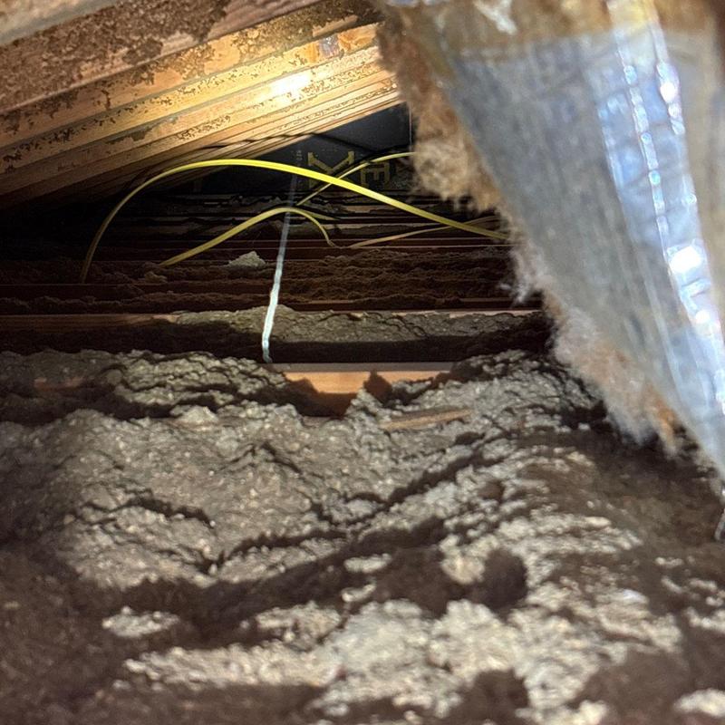Attic blown-in insulation with electrical wiring
