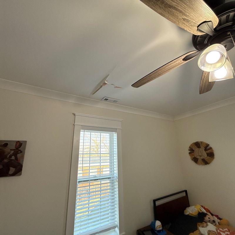 Ceiling drywall with peeling paint near vent and fan