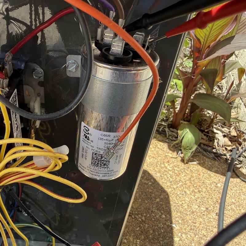 AC start capacitor with connected wiring and probes AC start capacitor with connected wiring and probes