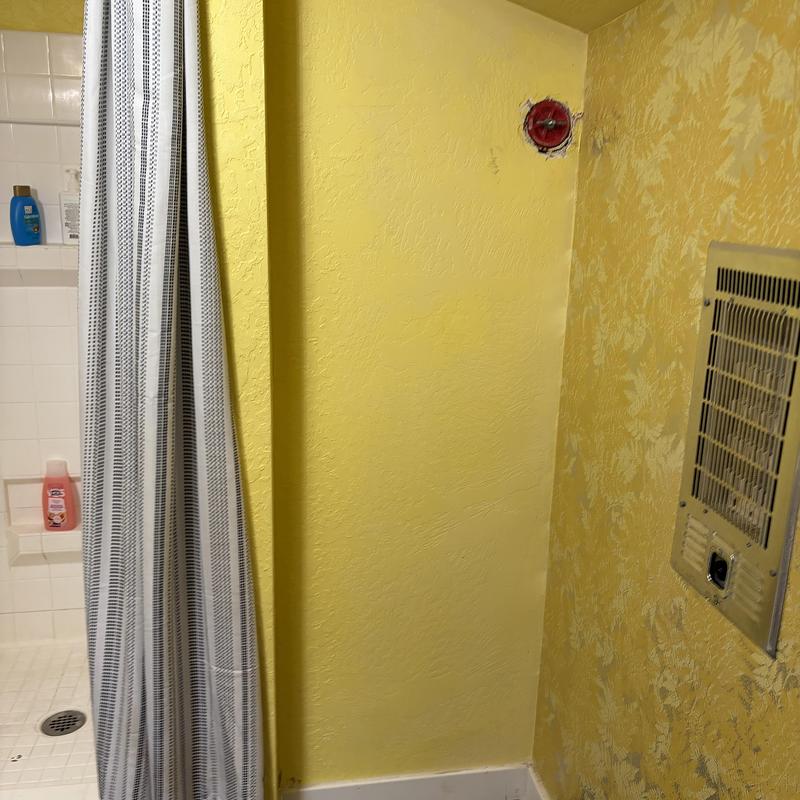 Basement toilet plumbing with wall heater and shower curtain Basement toilet plumbing with wall heater and shower curtain