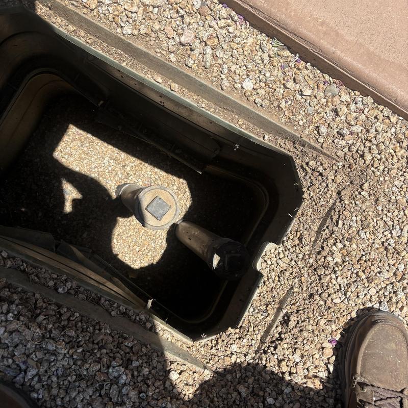Ground level cleanout pipe box underground view