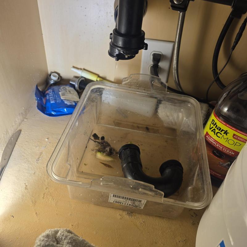 Kitchen sink P-trap with clog and parts Kitchen sink P-trap with clog and parts