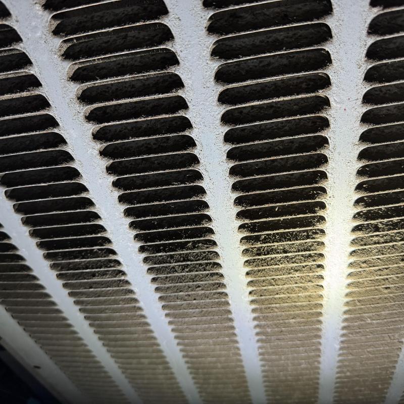 Condenser coil with restricted airflow and dust buildup Condenser coil with restricted airflow and dust buildup