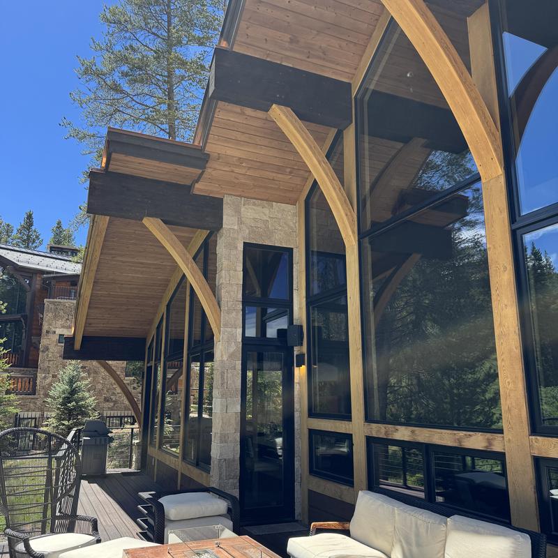 Roof overhang and wooden beam structure on patio Roof overhang and wooden beam structure on patio