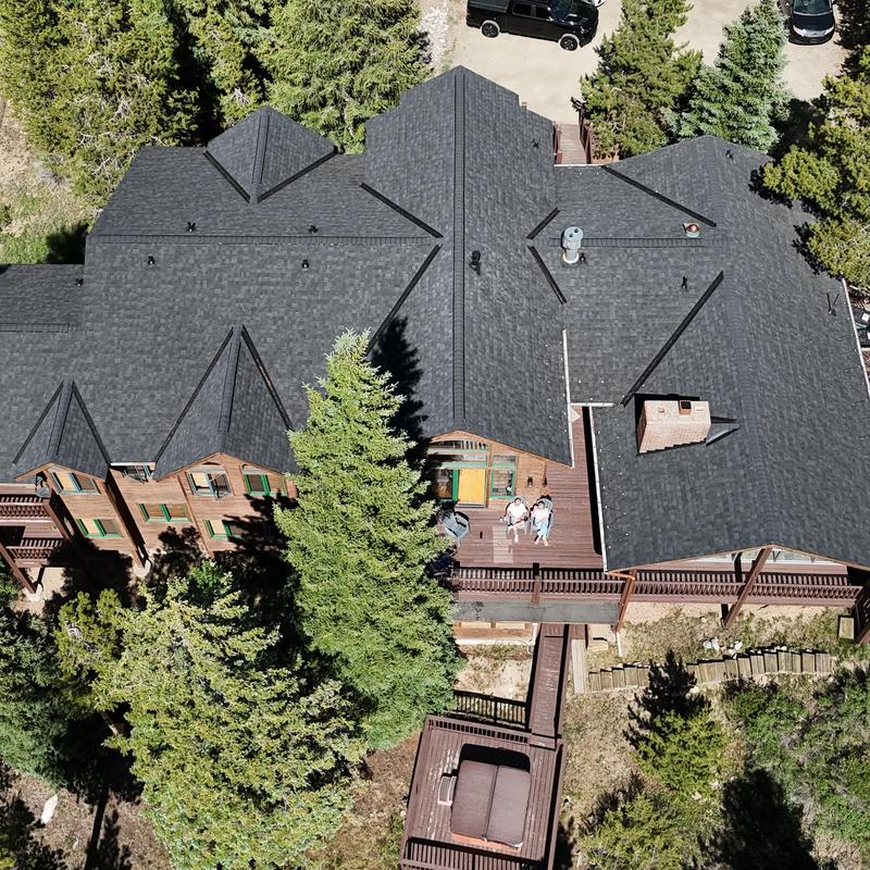 Asphalt shingle roof with new gutters and heat tape