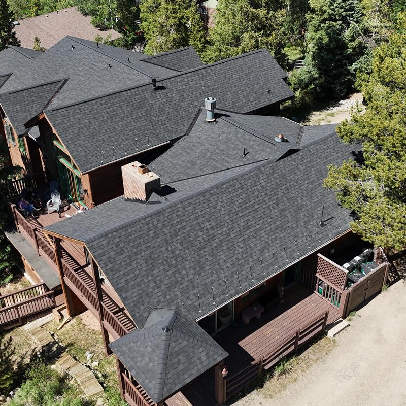 Asphalt shingle roof with new gutters and heat tape