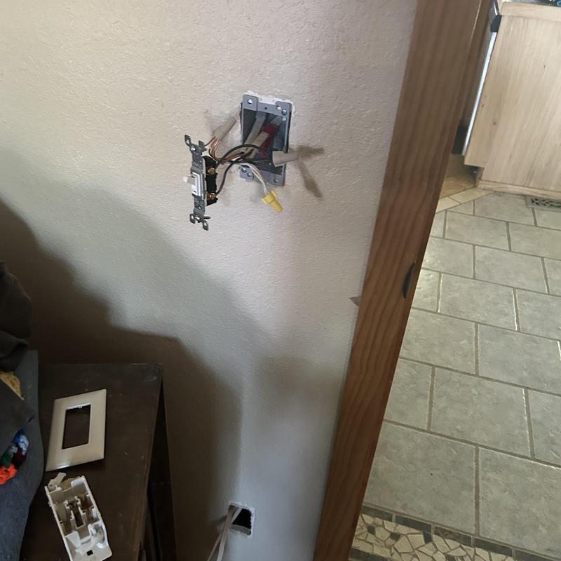 Older electrical outlet box with exposed wiring